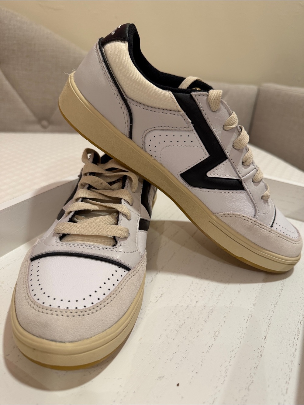 Vans White Sneakers with Black Accents and Cream Sole